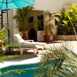 Comfy loungers by the Belenos Inn pool