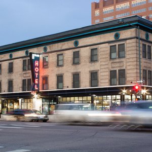 The exterior of 11th Avenue Hostel with vintage neon sign. Conveniently located in downtown Denver, Colorado.