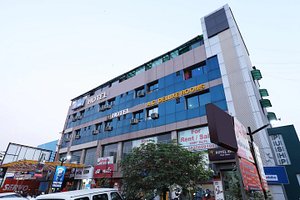 OYO 22477 Hotel Blue Moon in Ahmedabad, image may contain: Office Building, City, Shopping Mall, Neighborhood