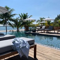 Grab a towel, claim a chair, and enjoy a day relaxing by our pool overlooking the Caribbean Sea.
