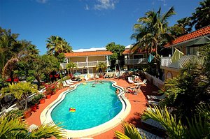 Tortuga Inn Beach Resort in Anna Maria Island, image may contain: Hotel, Resort, Villa, Summer