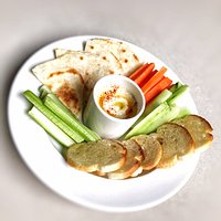 Hummus Platter: House made hummus served with assorted vegetables, crostini and flatbread. (VEGAN)