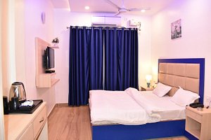 Hotel Shagun Residency in Mathura, image may contain: Monitor, Bed, Furniture, Bedroom