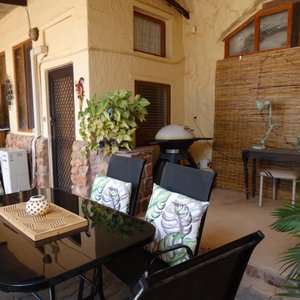 Outside area at Dinky Di's has a gas BBQ and cosy seating area.