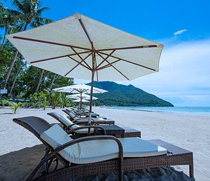 Daluyon Beach and Mountain Resort in Palawan Island, image may contain: Chair, Furniture, Canopy, Beach