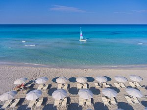 Vivosa Apulia Resort in Ugento, image may contain: Beach, Sea, Nature, Sailboat