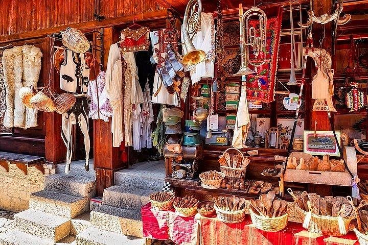 Albanian souvenirs and traditional costumes for sale at Kruja castle.