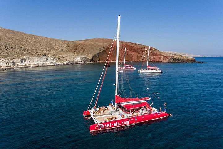 sunset oia sailing catamaran