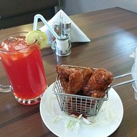 Buffalo Chicken Wings and Chapman. 🍖 🍹 😋