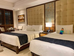 Henann Prime Beach Resort in Panay Island, image may contain: Furniture, Bed, Bedroom, Hotel