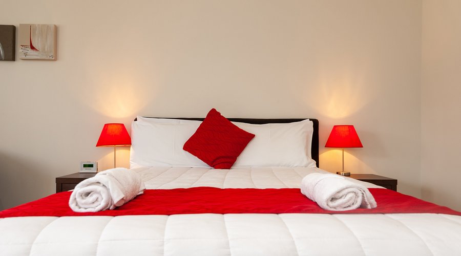 The queen size bed of The Park Motel in Studio room, One Bedroom and Access Rooms 