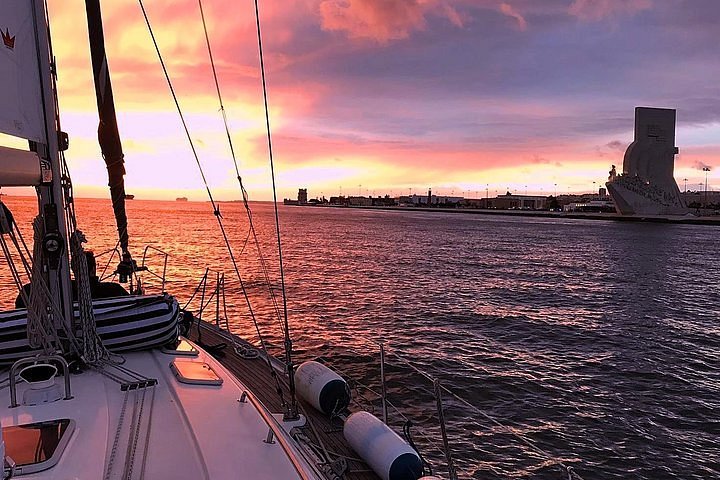 sunset sailboat lisbon