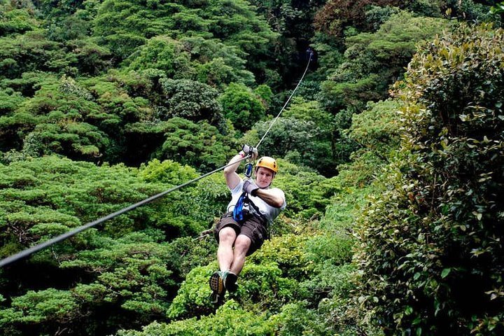 Tourist arriving to platform on a canopy cable ride, Monteverde, Santa  Elena, Costa Rica, Central America Stock Photo - Alamy