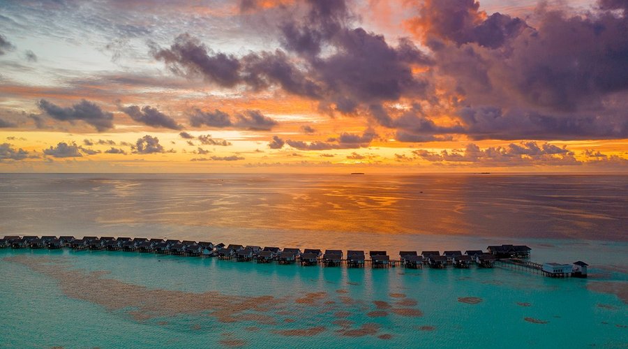 OZEN by Atmosphere at Maadhoo - Water Villa Jetty - Aerial View at Sunset