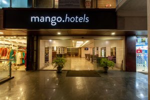 Hotel Central Park in Manipal, image may contain: Shopping Mall, Shop, Book, Publication