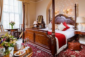 Dingle Benners Hotel in Dingle, image may contain: Furniture, Handbag, Bedroom, Indoors