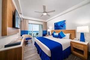 South Gap Hotel in Barbados, image may contain: Ceiling Fan, Dorm Room, Bedroom, Corner