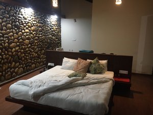 Gaj Retreat A Luxury Eco - Resort & Spa in Mansowal, image may contain: Interior Design, Bed, Furniture, Hotel