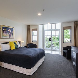 Pavilions Hotel in Christchurch, image may contain: Dorm Room, Furniture, Bedroom, Chair