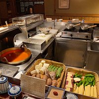 Everything is prepped for dinner. The chef waits for everyone to be seated before he appears