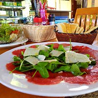 Greek salad and beef carpaccio, I eat there very often