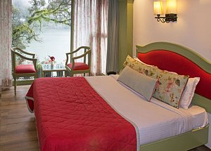 Lakeside Inn in Nainital, image may contain: Resort, Hotel, Chair, Bed