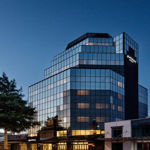 Hotel exterior.  The hotel is located in the city center, moments from the lakefront and a short walk to Government Gardens.  