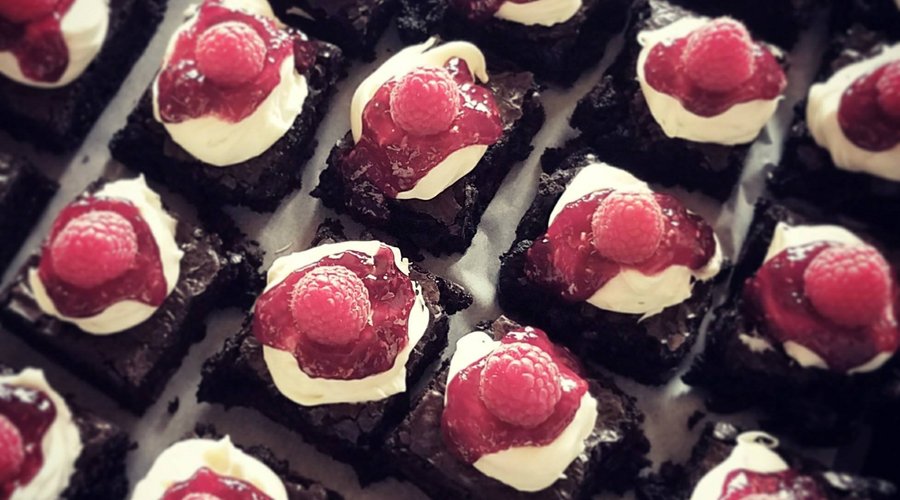 Chocolate Cake with White Chocolate Frosting and Raspberry Sauce - CATERING