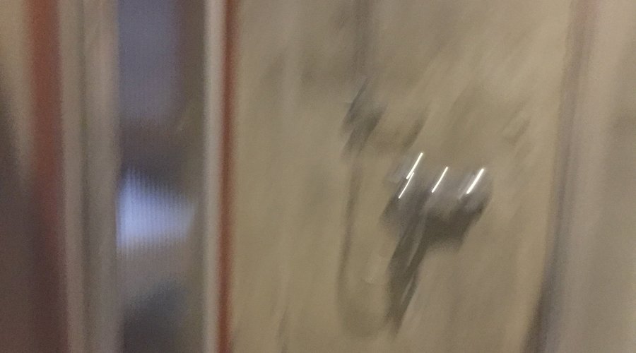 sorry for the blurriness. Again, unfinished concrete walls in the shower.
