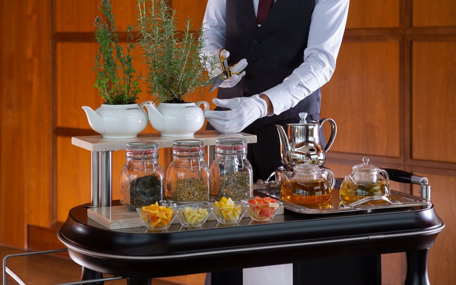 Tea ceremony, using fresh herbs and fruits, presented table-side. 