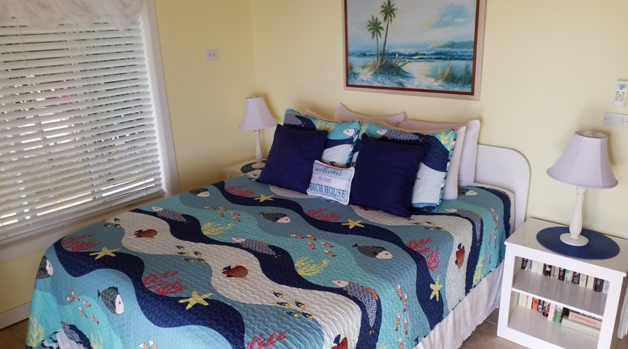 Mermaid bedroom with queen bed overlooking the water
