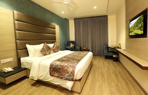 Hotel Dara Royale in Amritsar, image may contain: Interior Design, Corner, Monitor, Screen