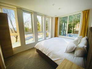 Wadano Forest Hotel & Apartments in Hakuba-mura, image may contain: Door, Bed, Furniture, Bedroom