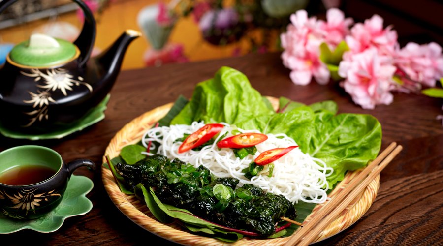 Cha La Lot - Flavourful rolls of beef & pork wrapped in betel leaves are grilled until fragrant, tossed with spring onions & peanuts
