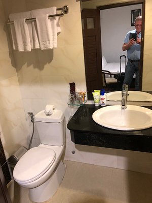 Bathroom counter with three hand towels - Picture of Flower Garden Hotel,  Ba Dinh - Tripadvisor