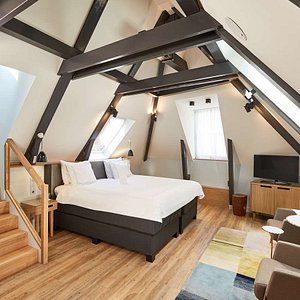 Swissotel Amsterdam in Amsterdam, image may contain: Loft, Housing, Indoors, House