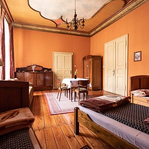 Quadraple room with private bathroom and with the wiew on the Synagogue under white stork.