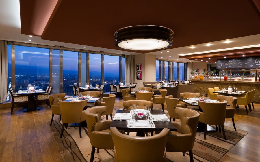 Welcoming atmosphere of the dining area, accompanied by mesmerizing movies. 