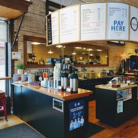 Stop in for a cup of coffee or tea to enjoy while you sip n' shop!