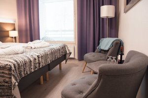 Spa Hotel Kunnonpaikka in Vuorela, image may contain: Furniture, Chair, Dorm Room, Lamp