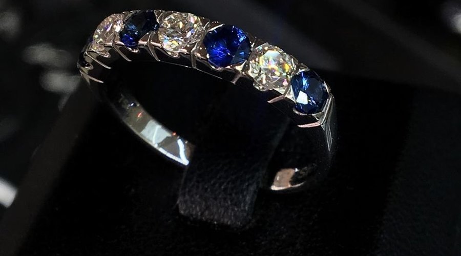 Good Quality Natural Blue Sapphire and Diamonds half eternity set on 18K white Gold. Size 55 
Please visit the shop and try on.