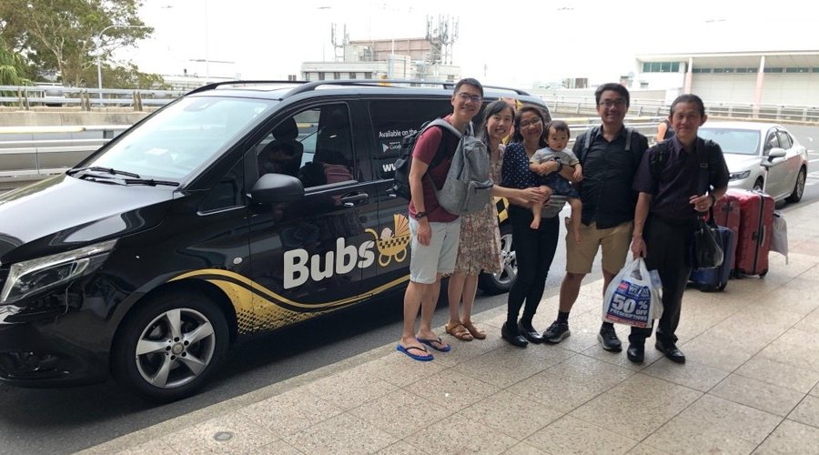 Family travelling back to the airport after a great cruise ship experience. 
