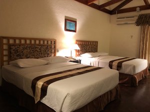 Airai Water Paradise Hotel & Spa in Babeldaob Island, image may contain: Hotel, Resort, Bed, Dorm Room