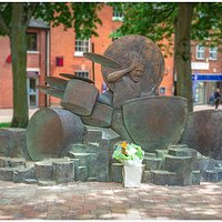 One side of the John Bonham Memorial Statue in Redditch town centre.