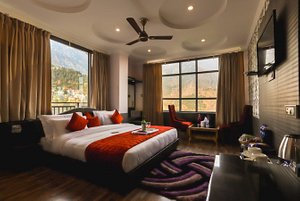 Hotel Holiday Hill in McLeod Ganj, image may contain: Ceiling Fan, Electrical Device, Device, Appliance
