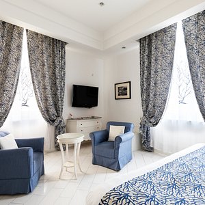 La Ciliegina Lifestyle Hotel in Naples, image may contain: Furniture, Bed, Lamp, Home Decor