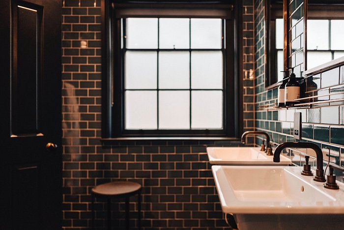 Woman At Sink Washing Dishes by George Marks