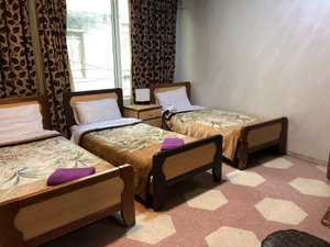 Arab Tower Hotel in Amman, image may contain: Hostel, Housing, Bed, Furniture