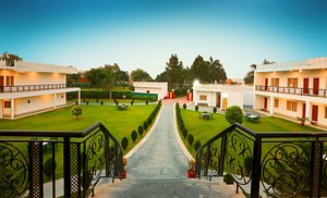 Aapno Ghar Resort in Gurugram (Gurgaon), image may contain: Villa, Resort, Hotel, Hacienda