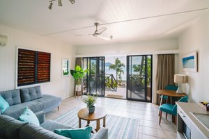 Palm Bay Resort in Long Island, image may contain: Door, Living Room, Housing, Table